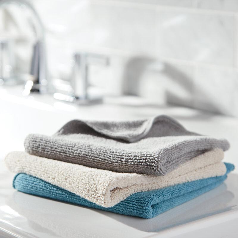 Rinse under warm water and use other side of cloth to continue