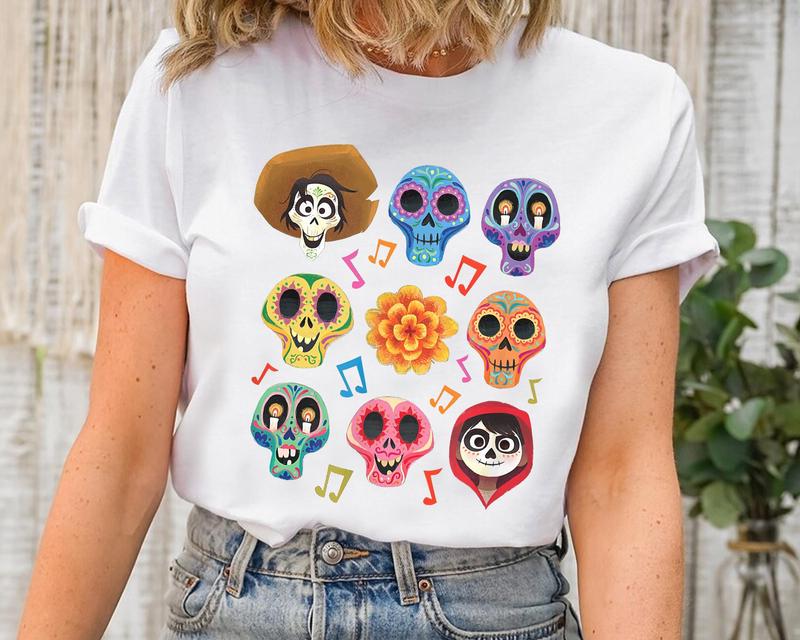 TikTok Shop Coco Character Grid Sugar Skulls Sweatshirt Coco Halloween Matching Tee Coco Papel Picado Sugar Skull T Shirt Dia De Los Muertos gift